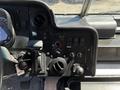Interior dashboard of a 2019 Freightliner MT45 featuring controls and gauges including gear shift air conditioning vents and various buttons