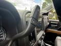 Interior view of a 2017 Chevrolet Silverado 1500 showing the gearshift lever and dashboard with speedometer and climate controls