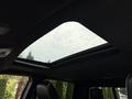 Sunroof of a 2024 RAM 3500 showcasing a clear glass panel with a sleek frame and visible interior details around it