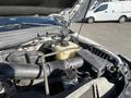2014 Ford F-350 SD engine with visible components including a coolant reservoir and air intake system