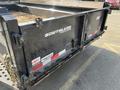 A Southland SL716-20K dump trailer with a black exterior showing branding and safety labels on the sides