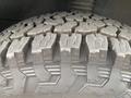 Close-up of a tire tread from a 2024 Mercedes-Benz Sprinter showing deep grooves and textured patterns designed for traction and performance