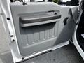 The image shows the interior door panel of a 2016 Ford F-550 featuring a gray design with a black handle and textured surface