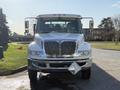 A 2017 International 4300 truck facing forward with chrome grille and side mirrors visible