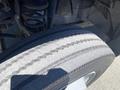 Close-up of a worn tire from a 2015 Ford F-450 SD showing visible tread wear and grooves