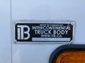 A metal plaque on a vehicle displaying the words "Made in Canada by Intercontinental Truck Body www.itb.ca" with a numerical code listed at the bottom