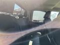 Interior of a 2011 RAM 1500 showing rear seats with black leather upholstery and headrests