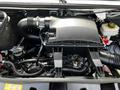 Close-up of the engine compartment of a 2019 Mercedes-Benz Sprinter showcasing the air filter housing and surrounding engine components