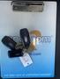 A 2017 Ford F-150 key fob is resting on a clipboard with a business logo and a tag labeled P071 along with another key fob