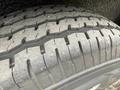 Close-up view of a 2025 Shuttle Office tire showing tread patterns and wear on the rubber surface