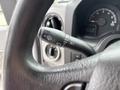 Close-up of the turn signal lever on a 2014 Ford E-350 with functions for headlights and windshield wipers visible
