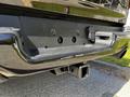 A close-up view of the rear of a 2019 RAM 1500 showcasing the hitch receiver and tailgate area without a visible license plate
