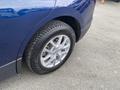 Close-up of a 2022 Chevrolet Equinox tire and alloy wheel showcasing the tread pattern and silver rim