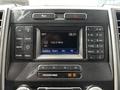 Dashboard of a 2017 Ford F-250 featuring a radio display with temperature and time indicators along with various control buttons
