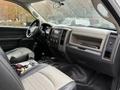 Interior of a 2012 Dodge Ram 5500 with a black and gray leather seat the dashboard features several controls and a touchscreen display