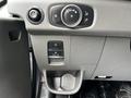 Interior dashboard controls of a 2022 Ford Transit including knobs for lights and various switches