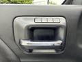 Close-up of the door handle and seat memory buttons of a 2017 Chevrolet Silverado 1500