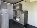 Interior of a 2017 Mercedes-Benz Sprinter van featuring shelving units and drawers with metal finishes designed for storage and utility purposes