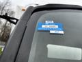 A close-up of a blue certificate of approval sticker on the windshield of a 2013 Hino 195 truck with the year 2025 and the number GC 78000