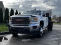 A 2017 GMC Sierra 3500HD pickup truck with a silver and black exterior features a front grill with a prominent GMC logo and chrome accents