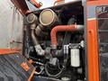 Close-up view of the engine compartment of a 2018 Doosan DL300-5 with visible piping, air filters, and other mechanical components