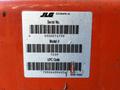 A label displaying the serial number and model information for a 2000 JLG 12SP including barcodes and identification details