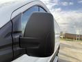 Close-up of the side mirror of a 2023 Ford Transit van