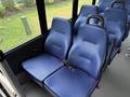 Interior seats of a 2020 Chevrolet Express with blue upholstery and seatbelts visible