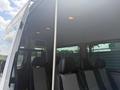 Interior view of a 2009 Dodge Sprinter Van showing seating area with cloth seats and overhead lights