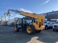 A yellow 2013 JCB 510-56 Loadall with large black tires extended boom and cabin designed for lifting and moving heavy materials