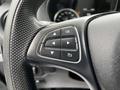Control panel on the steering wheel of a 2020 Mercedes-Benz Metris featuring navigation buttons and a central OK button