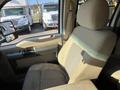A driver side seat of a 2014 Ford F-350 SD with a cloth upholstery and a comfortable design featuring a high back and armrest