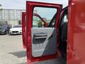 2013 Ford F-550 with an open passenger door showing a gray interior door panel and black handle