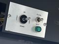 Control panel with labeled switches for up down left right flood and spot functions