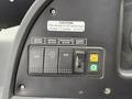 Control panel of a 2018 Grande West Vicinity bus featuring buttons for driver heater mirror de-icer windshield de-icer and dimmer switch
