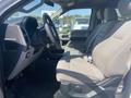 Interior of a 2017 Ford F-150 showing the driver's seat and steering wheel with cloth upholstery and controls visible on the dashboard
