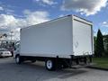 White 2007 GMC W5500 18 Foot Cube Van with a boxy cargo area and rear loading door