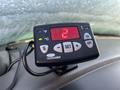 A digital temperature display unit mounted on the dashboard of a 2005 Chevrolet Express showing a reading of 29 degrees with buttons for temperature settings and power