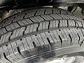 Close-up of a treaded tire from a 2020 Mercedes-Benz Sprinter showcasing deep grooves and patterns for traction