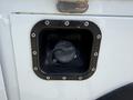 Fuel filler neck of a 2020 Ram 2500 featuring a circular cap secured with screws