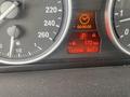 Dashboard display of a 2009 BMW X5 showing speedometer fuel gauge mileage and trip information