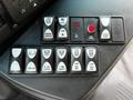 A control panel featuring various switches for mirror defrost, lift door, rear flasher, dome lights, and master controls from a 2020 Chevrolet Express