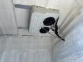 A ceiling-mounted Volta Air cooling unit with two fans inside a vehicle
