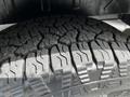 Close-up of the tire tread on a 2022 Ford Transit showcasing deep grooves and patterns designed for grip and traction