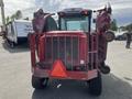 A red 2014 Toro Groundmaster 5910 with a protective grille and dual mowing decks attached on either side facing forward
