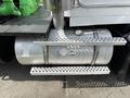 A 1996 Kenworth T800 truck featuring a metallic fuel tank with a hazard label and a perforated metal step on the side for access to the truck's cab