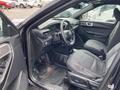 Interior of a 2021 Ford Explorer showing the front seats dashboard and steering wheel with controls visible