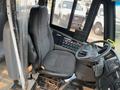 Interior view of a 2007 Freightliner B2 showing the driver's seat and dashboard controls