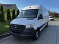 2022 Mercedes-Benz Sprinter van with a white exterior and black front grille positioned at an angle