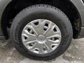 A close-up of a silver alloy wheel and black tire from a 2020 Ford Transit with a detailed tread pattern and visible branding on the tire sidewall